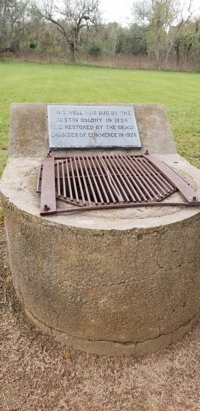 The Well is covered by a metal grate to prevent anything from falling down the well shaft. image. Click for full size.