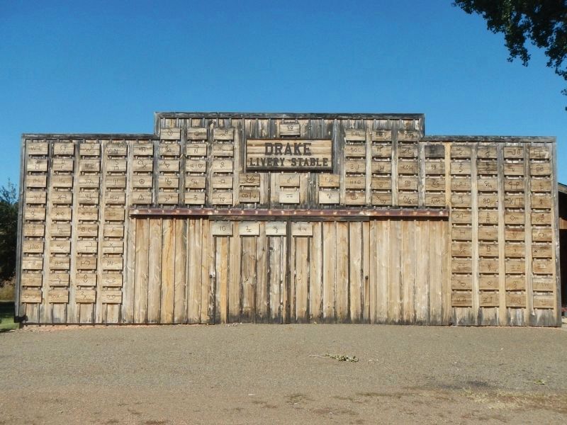 Drake Livery Stable with local brands affixed to the outside. image. Click for full size.