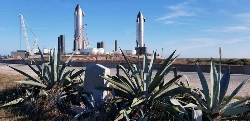 The Palmetto Piling Marker in reverse with 2 SpaceX Starships across the road image. Click for full size.