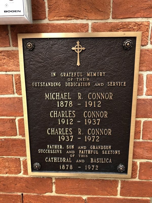 Additional plaque on the grounds of the Basilica image. Click for full size.