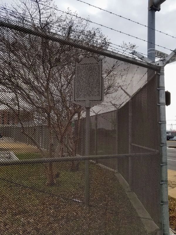 Transportation Marker Behind Fence Obscuring View image. Click for full size.
