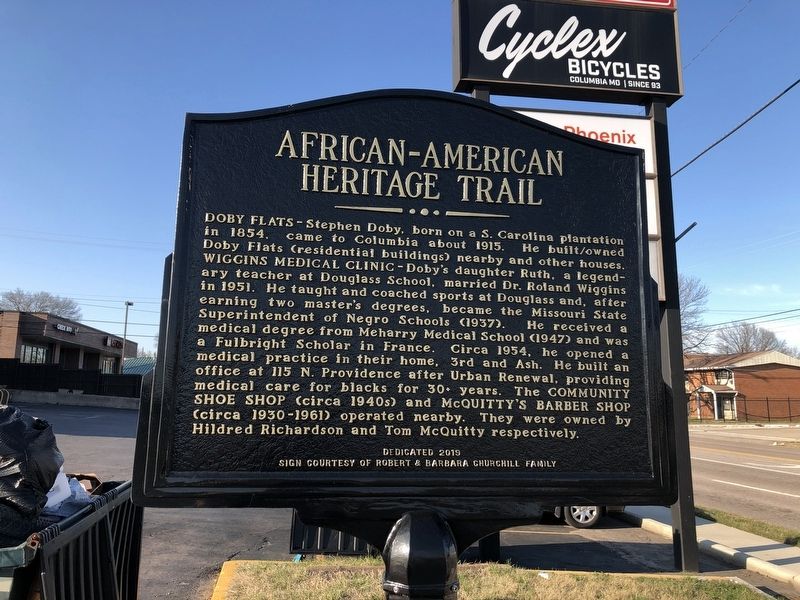 Doby Flats / Wiggins Medical Clinic / Community Shoe Shop / McQuitty's Barber Shop Marker image. Click for full size.