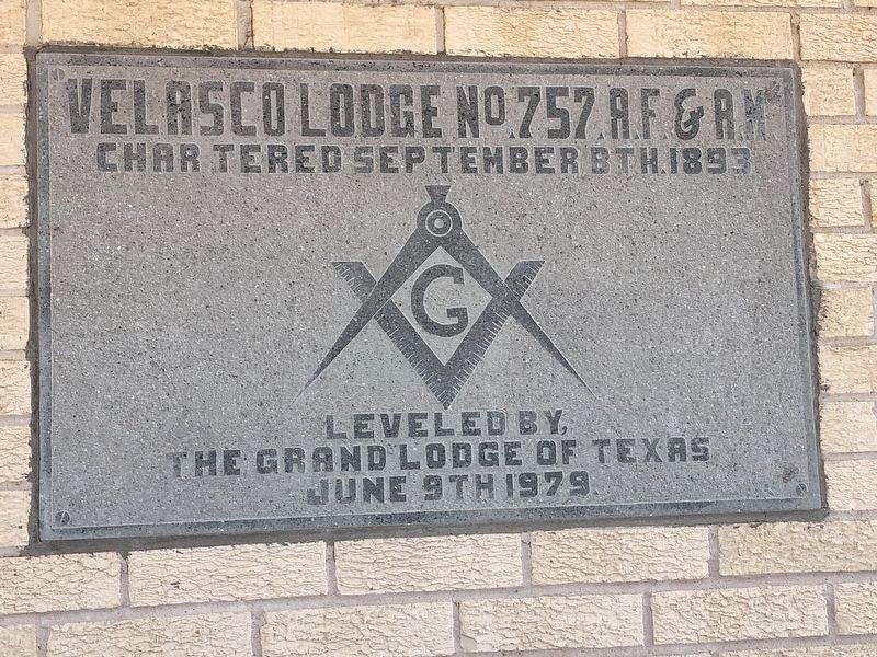 Builder's stone embedded in the lodge building image. Click for full size.