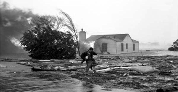 "Charlotte reporter Julian Scheer braves the wreckage in front of a burning house in Carolina Beach" image. Click for full size.