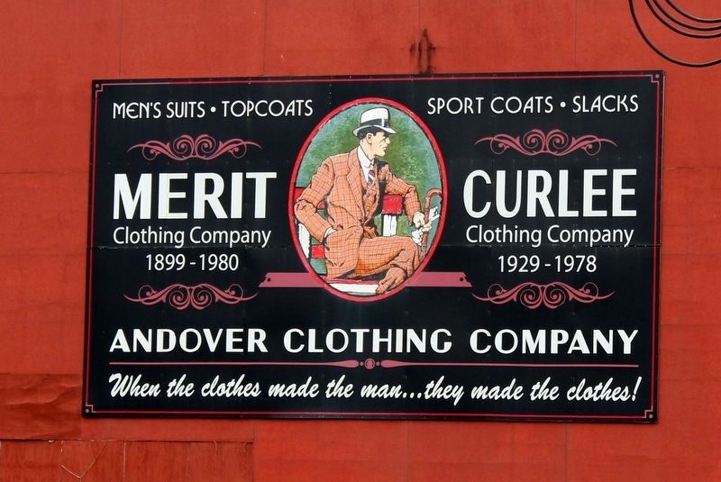 Merit Clothing Company repainted sign on nearby building. image. Click for full size.