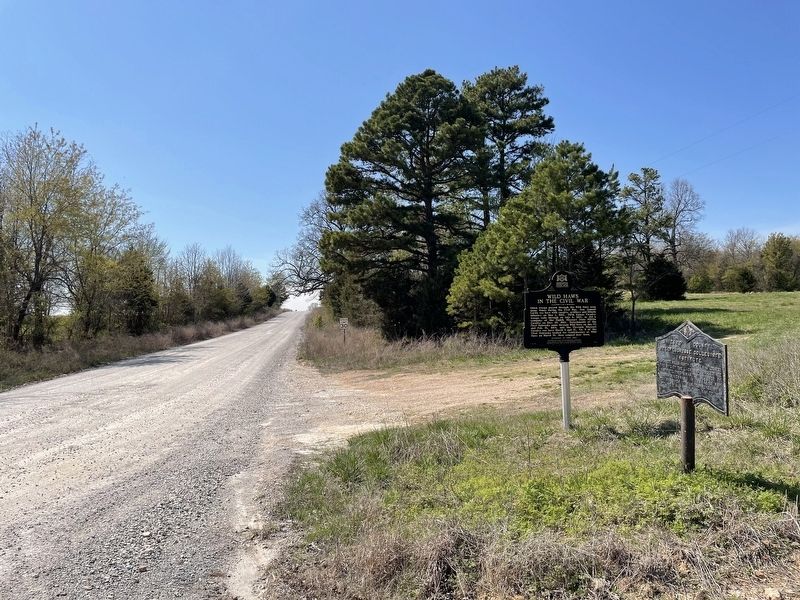 View of marker looking west along County Road 57. image. Click for full size.
