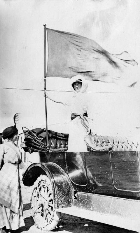 <i>Jeannette Rankin, Chairman Montana Activities, holding suffrage banner</i>. Click for full size. <i>Jeannette Rankin, Chairman Montana Activities, holding suffrage banner</i> image. Click for full size.