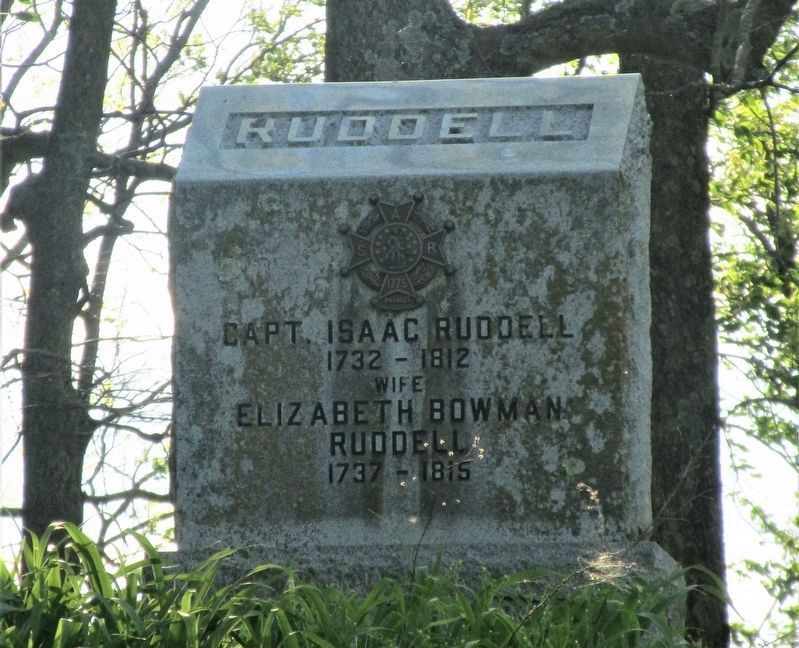 The grave of Isaac Ruddell in the nearby cemetery image. Click for full size.