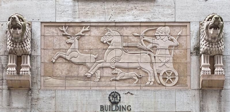 Terra cotta reliefs above building entrance image. Click for full size.