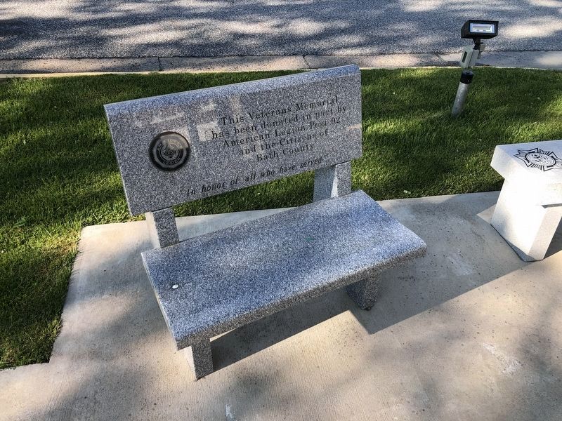 Bench adjacent to the memorial image. Click for full size.