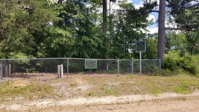The view of the Tobias Magee Estate Marker and cemetery from the road. Click for full size. The view of the Tobias Magee Estate Marker and cemetery from the road image. Click for full size.