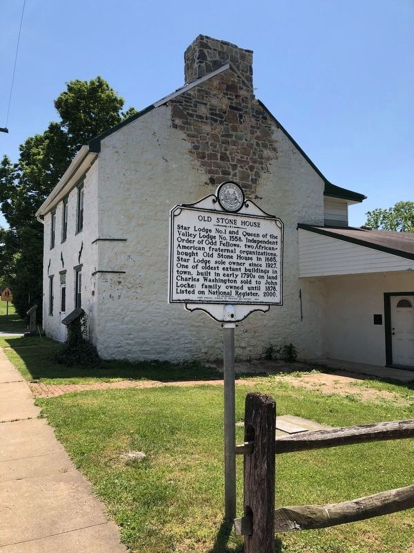 Old Stone House marker in front of the house image. Click for full size.