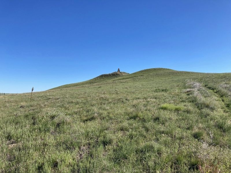 Monument can be seen on top of this hill image. Click for full size.