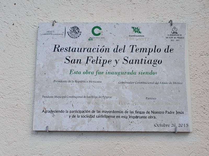 A nearby tablet noting the 2015 restoration of the Temple of San Felipe y Santiago image. Click for full size.