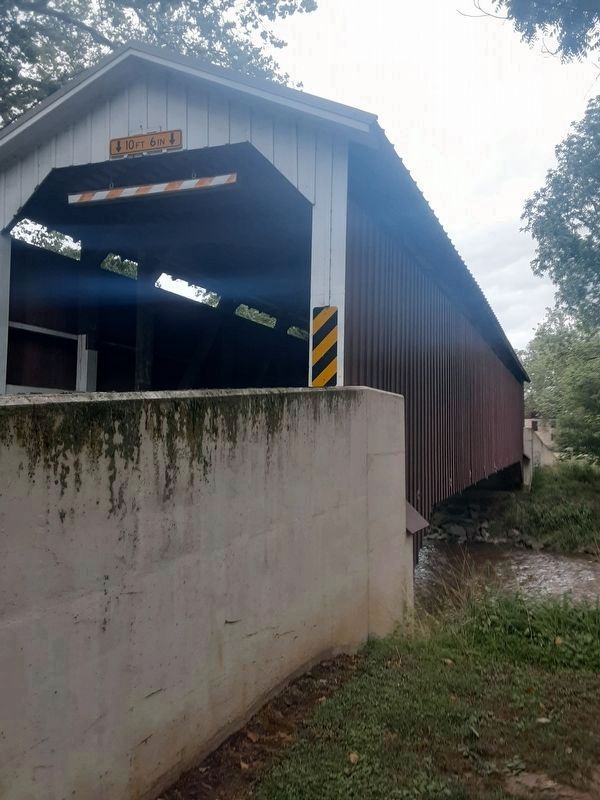 Baumgardner's Mill Covered Bridge -- Looking north. The marker, across the creek, cannot be seen. image. Click for full size.