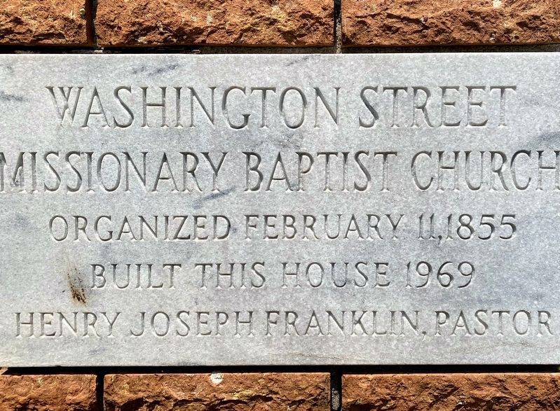 Inscription above the church cornerstone image. Click for full size.