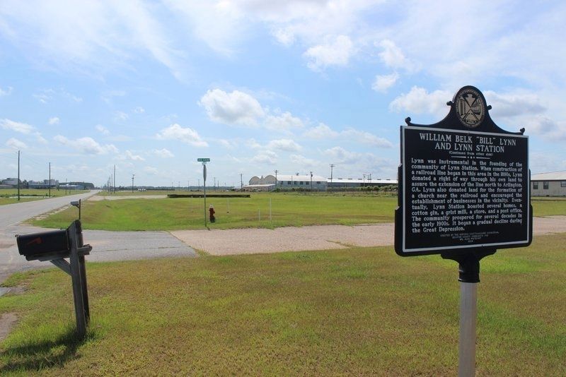 William Belk "Bill" Lynn and Lynn Station Marker looking east image. Click for full size.