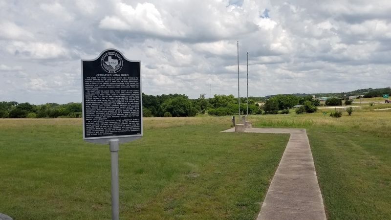 The memorial is located to the ride side of the Texas state historical marker image. Click for full size.