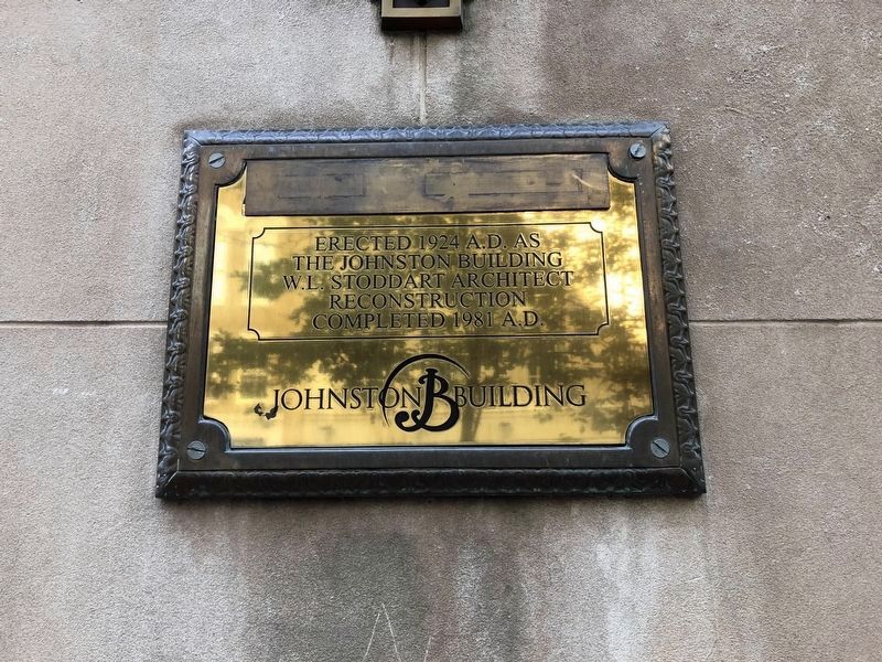 Plaque on the Johnston Building image. Click for full size.