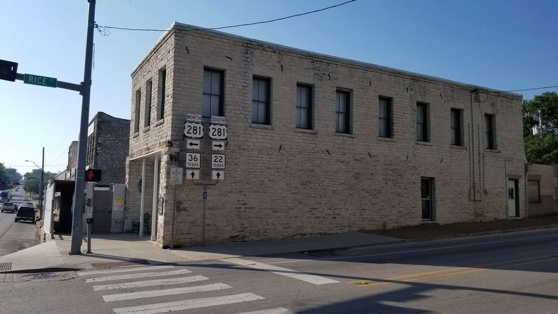 A view of the Rice-Eidson Building Marker from across Hwy 281. image. Click for full size.
