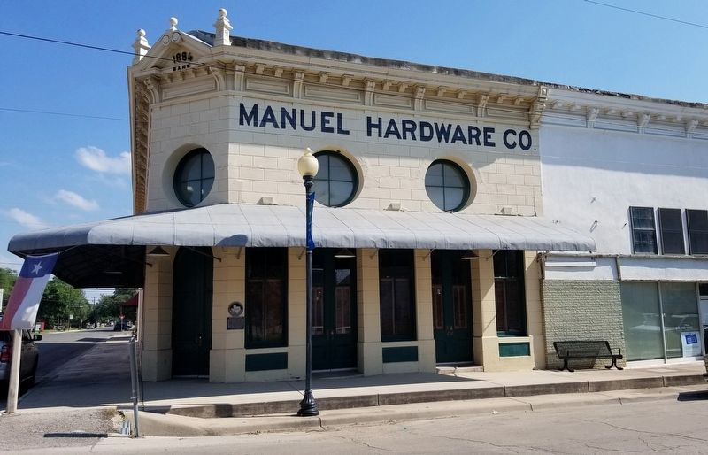 The view of the Manuel Hardware Building and Marker from the street image. Click for full size.
