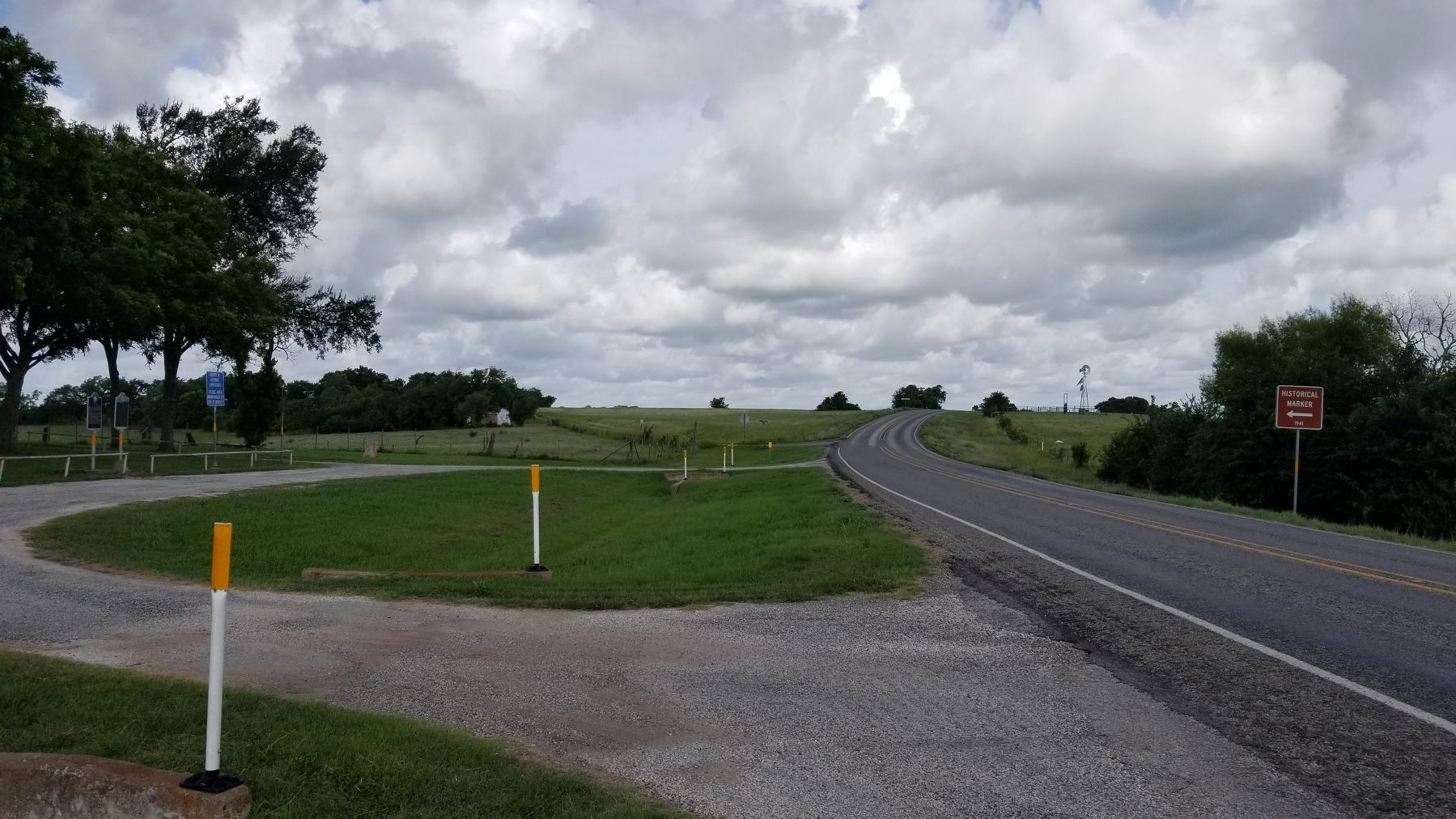 The two markers can be seen from the road on the left image. Click for full size.