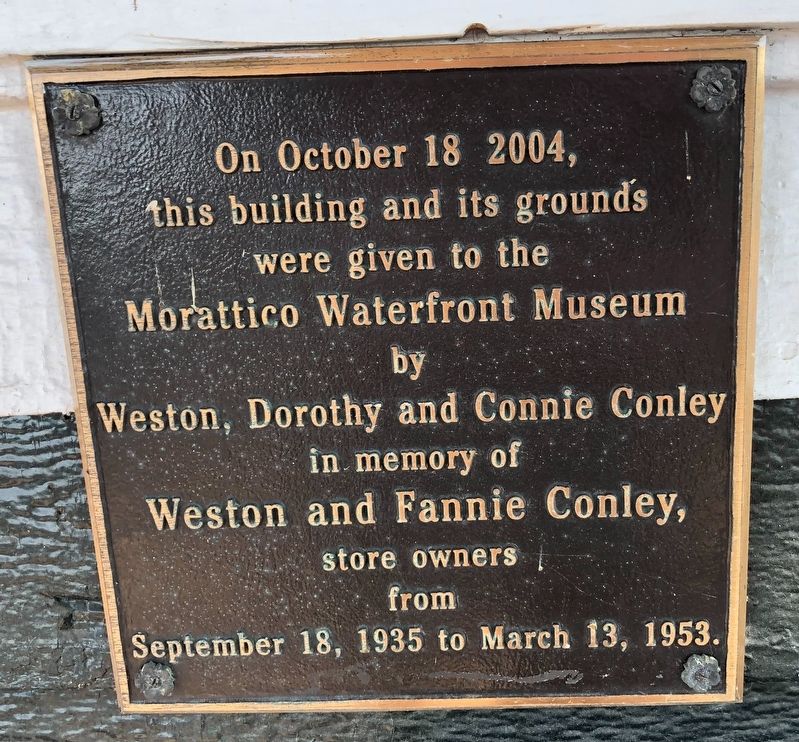 Dedication plaque on the nearby building image. Click for full size.