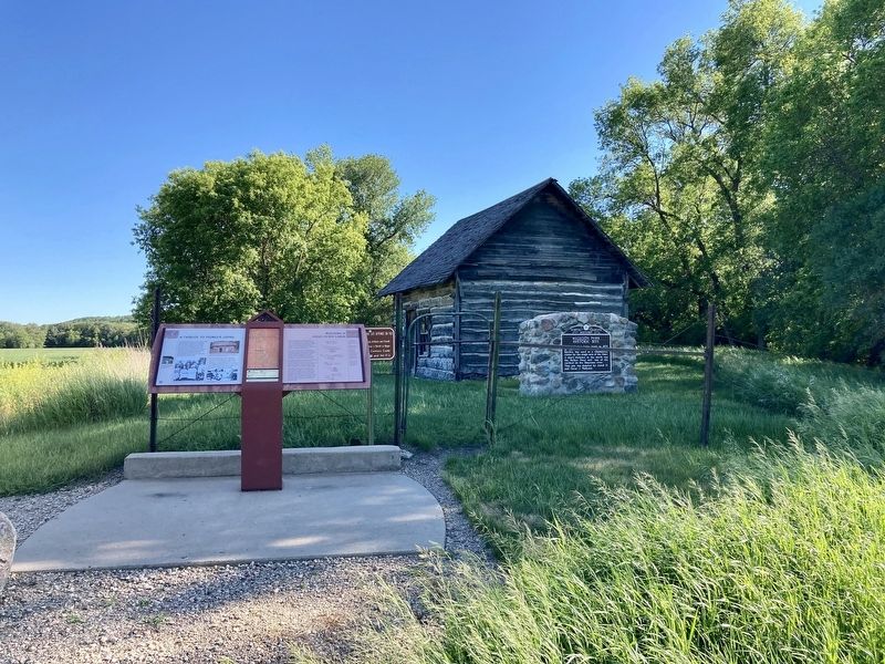 A tribute to pioneer living/Building a hand-hewn cabin Marker. Click for full size. A tribute to pioneer living/Building a hand-hewn cabin Marker image. Click for full size.