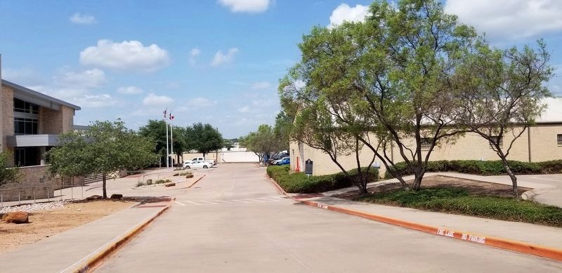 The view of the Texas World War II Home Front Marker from the driveway between the buildings image. Click for full size.
