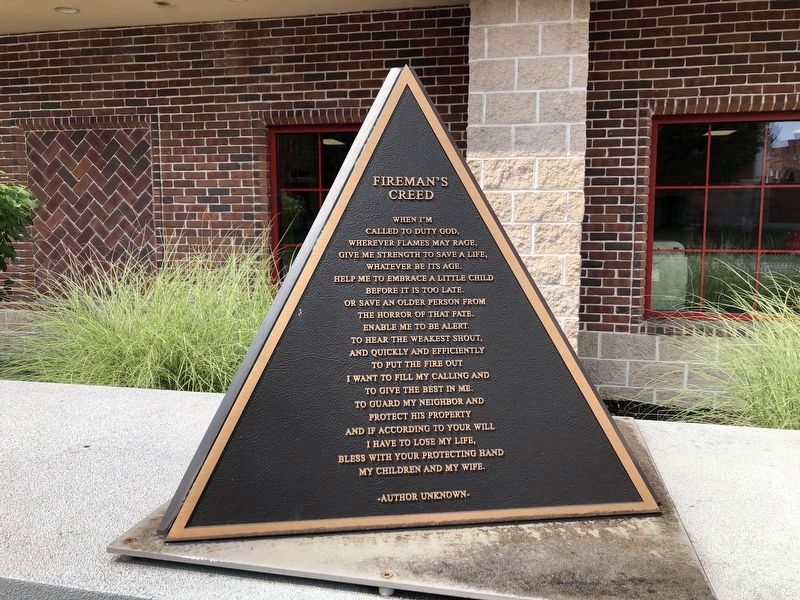 Fireman's Creed -- On the top of the memorial image. Click for full size.