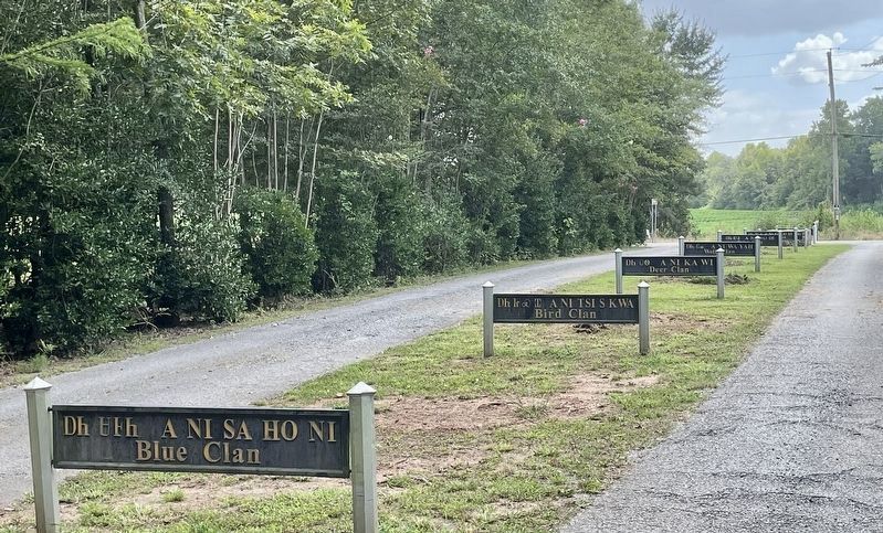 Entrance metal markers honoring the Cherokee clan names. image. Click for full size.