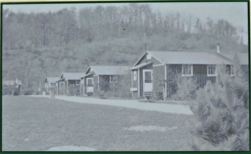 Barracks along a landscaped street in Lower Falls Camp 49. image. Click for full size.