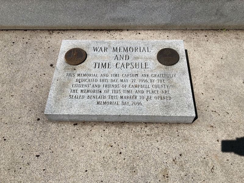 Time capsule on the ground directly in front of the memorial image. Click for full size.