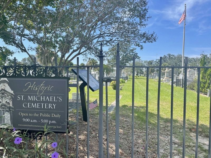 View of marker with part of cemetery in background. image. Click for full size.
