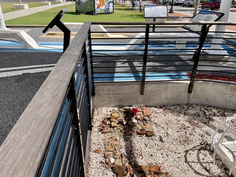 Excavation of cooking area next to marker.. Click for full size. Excavation of cooking area next to marker. image. Click for full size.