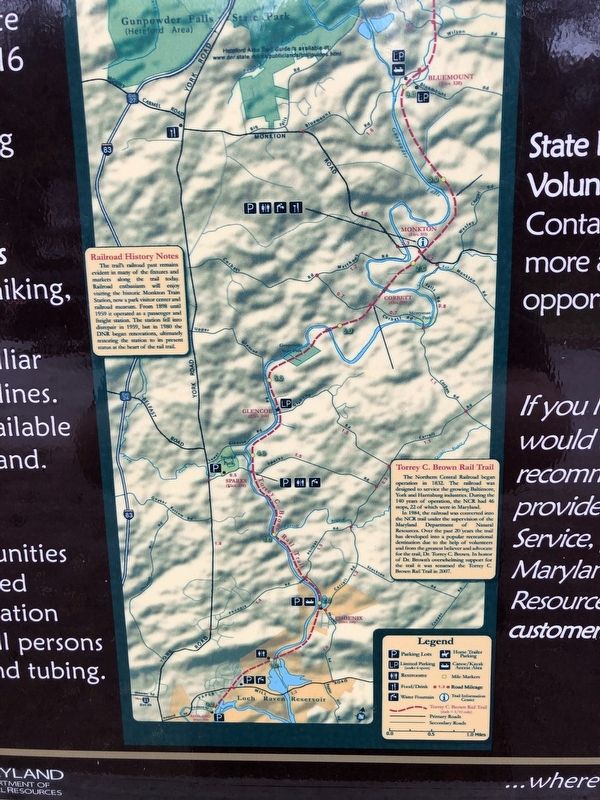 Zoomed in on the center of the signage where the historical information is found. image. Click for full size.