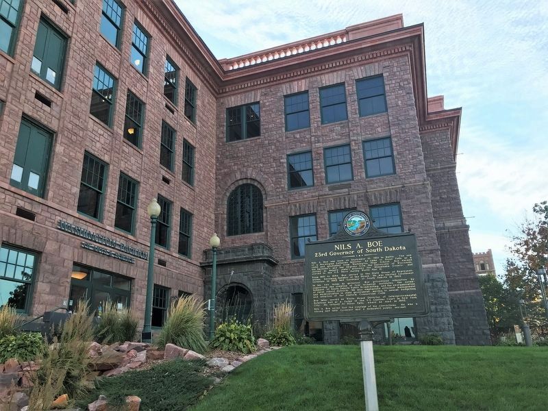 Nils A. Boe Marker and Washington High School (now the Washington Pavilion). Click for full size. Nils A. Boe Marker and Washington High School (now the Washington Pavilion) image. Click for full size.