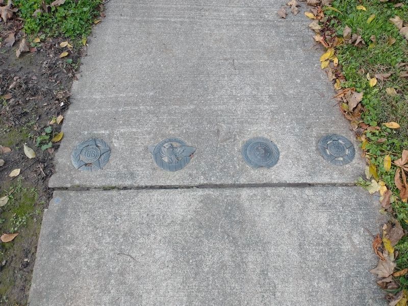 On the sidewalk behind the shell image. Click for full size.