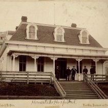 Matted photo of the second Homestake Hospital, which was located on Main Street in Lead. image. Click for full size.