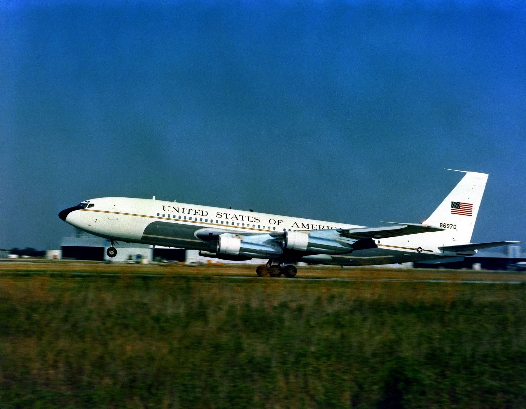 A left side view of a VC-137B Stratoliner aircraft taking off. image. Click for full size.