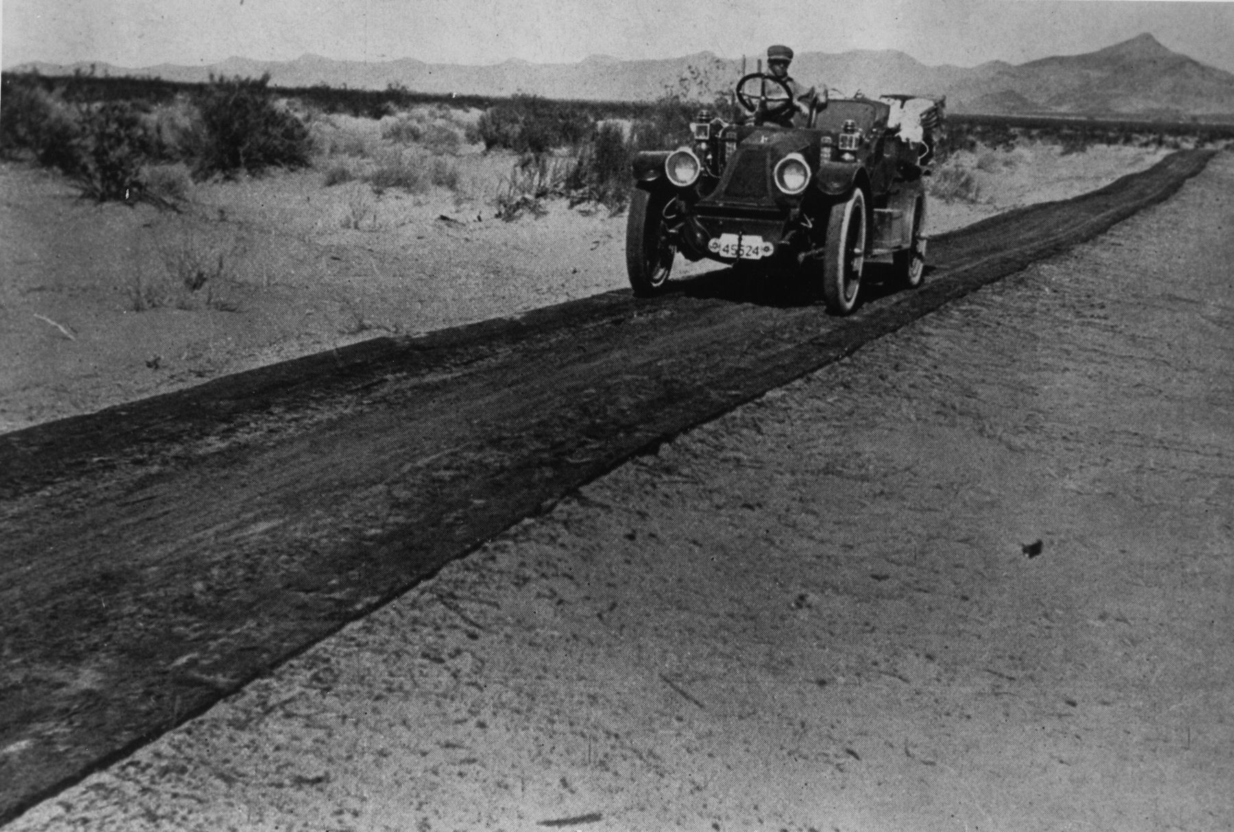 Vehicle traveling the wooden Plank Road image. Click for full size.