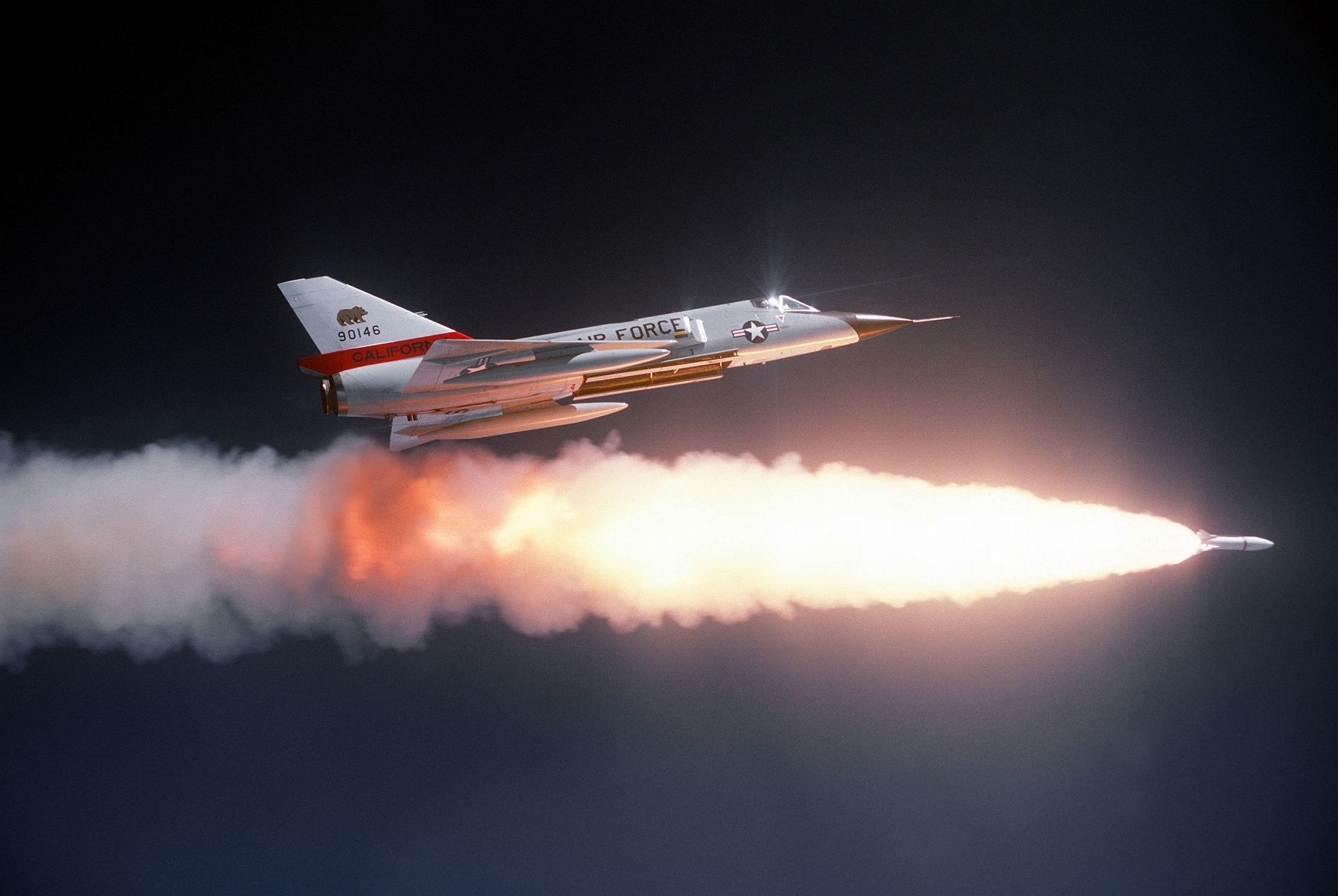 A Convair F-106 of the California Air National Guard fires an inert version of the Genie. Click for full size. A Convair F-106 of the California Air National Guard fires an inert version of the Genie image. Click for full size.