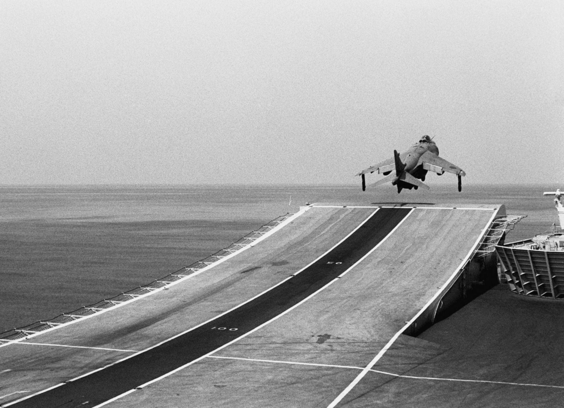 Sea Harrier using the ski-jump during takeoff from HMS Invincible image. Click for full size.