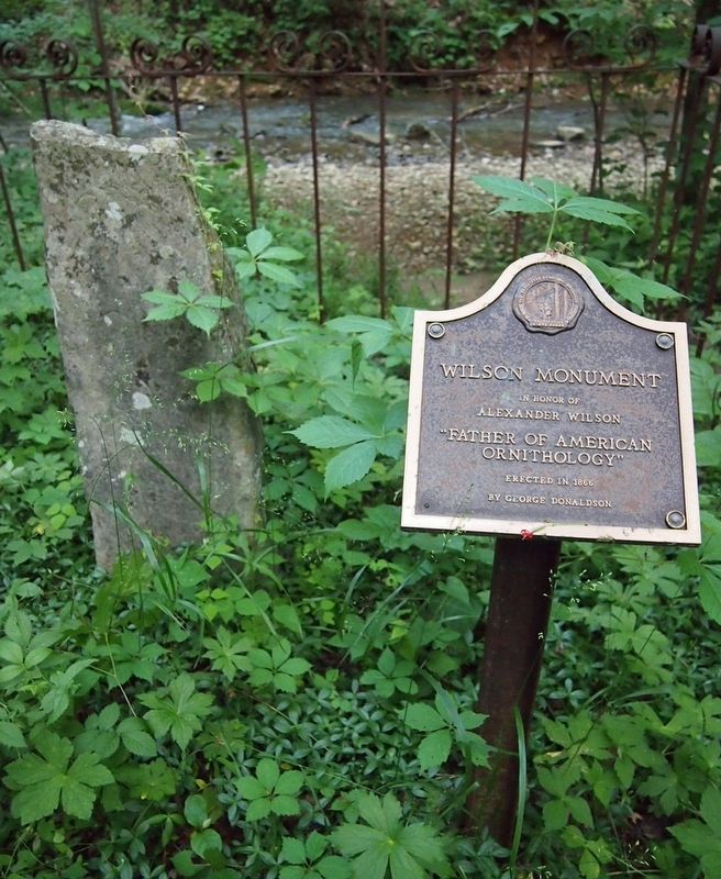 The 1866 Wilson Monument and a modern marker duplicating its original text image. Click for full size.