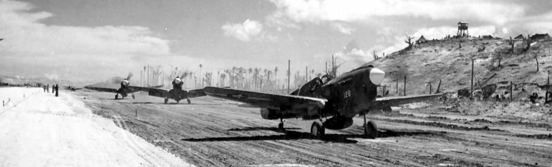 P-40s of the 44th FS Vampires, 18th Fighter Group, on Munda airstrip - August 1943 image. Click for full size.