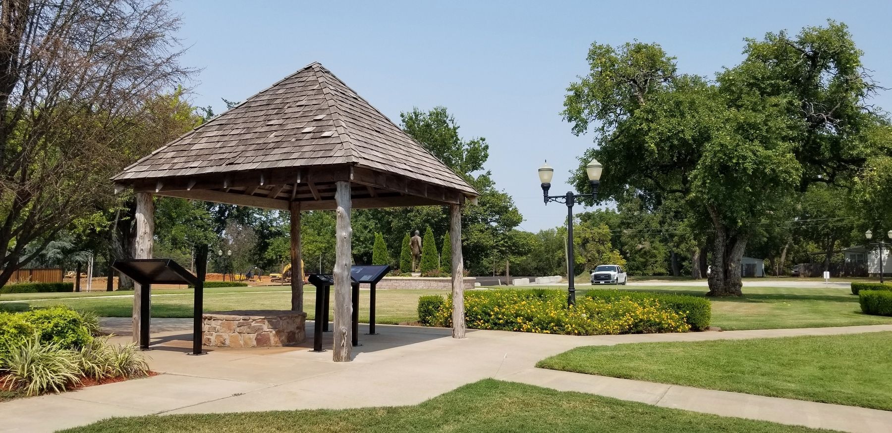 The view of the Capitol Well and three markers around it image. Click for full size.