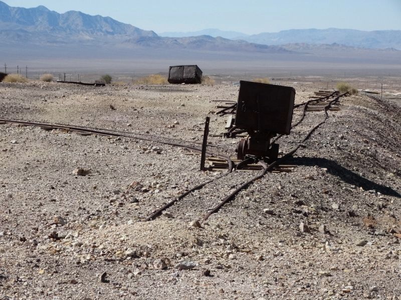 Lonely old mining cart still on its tracks image. Click for full size.