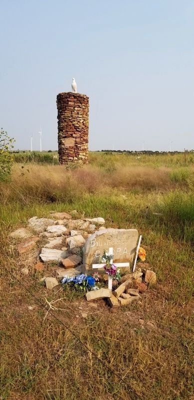 The gravestone of Bill Pickett and the stone cairn with White Eagle on top image. Click for full size.