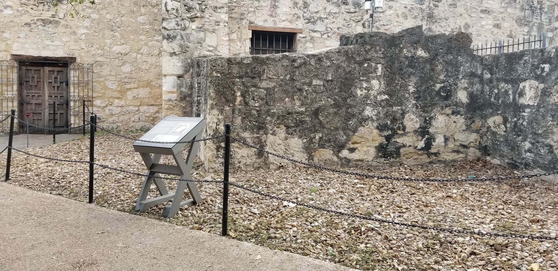The view of the Archaeological Puzzle Marker next to the Alamo. Click for full size. The view of the Archaeological Puzzle Marker next to the Alamo image. Click for full size.