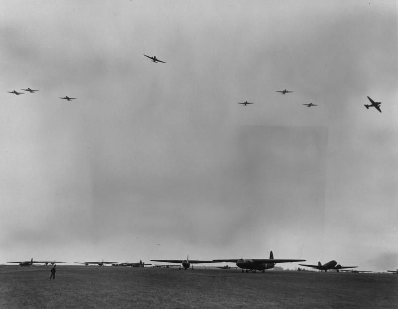 C-47 Skytrains of the 437th Troop Carrier Group fly over Horsa gliders during a practice mission. image. Click for full size.